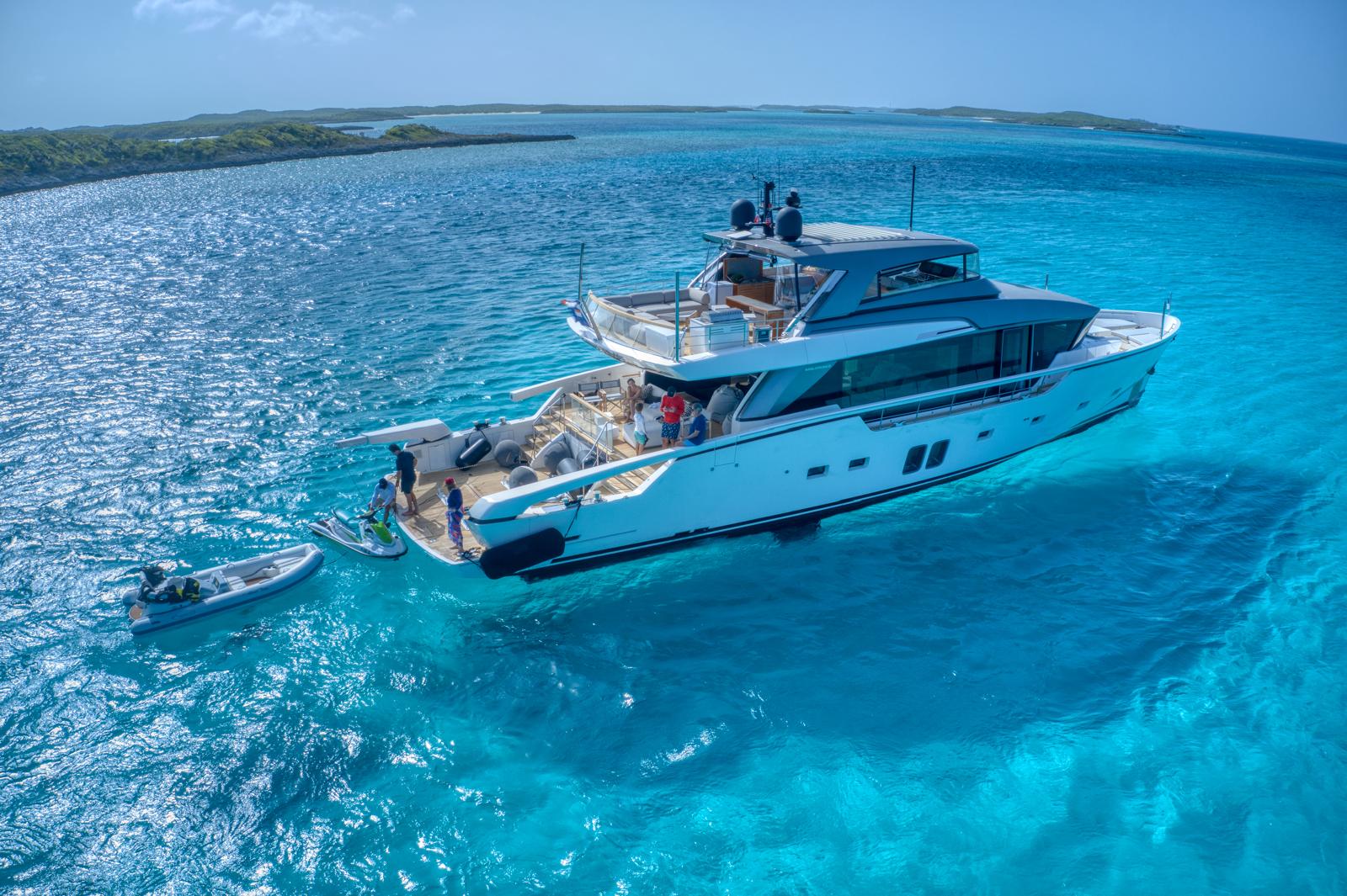 Luxury motor yacht anchored in turquoise Bahamian waters